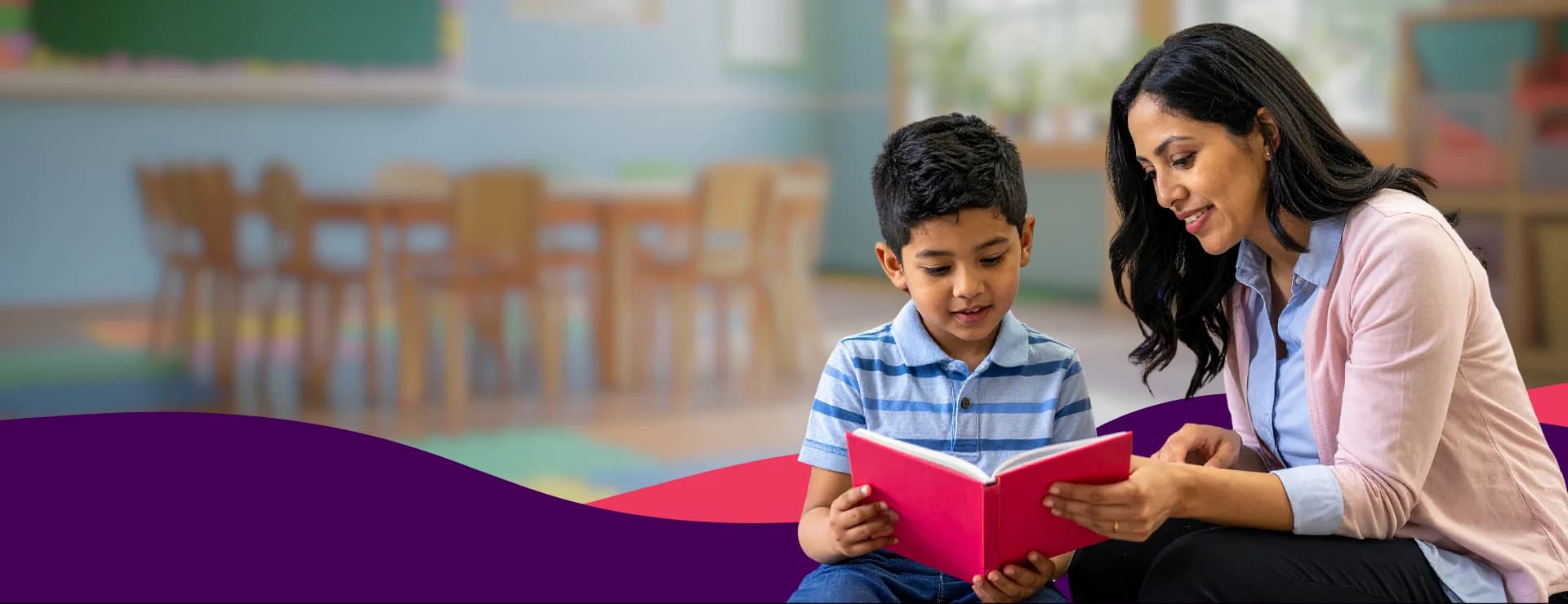 Mother helping child read