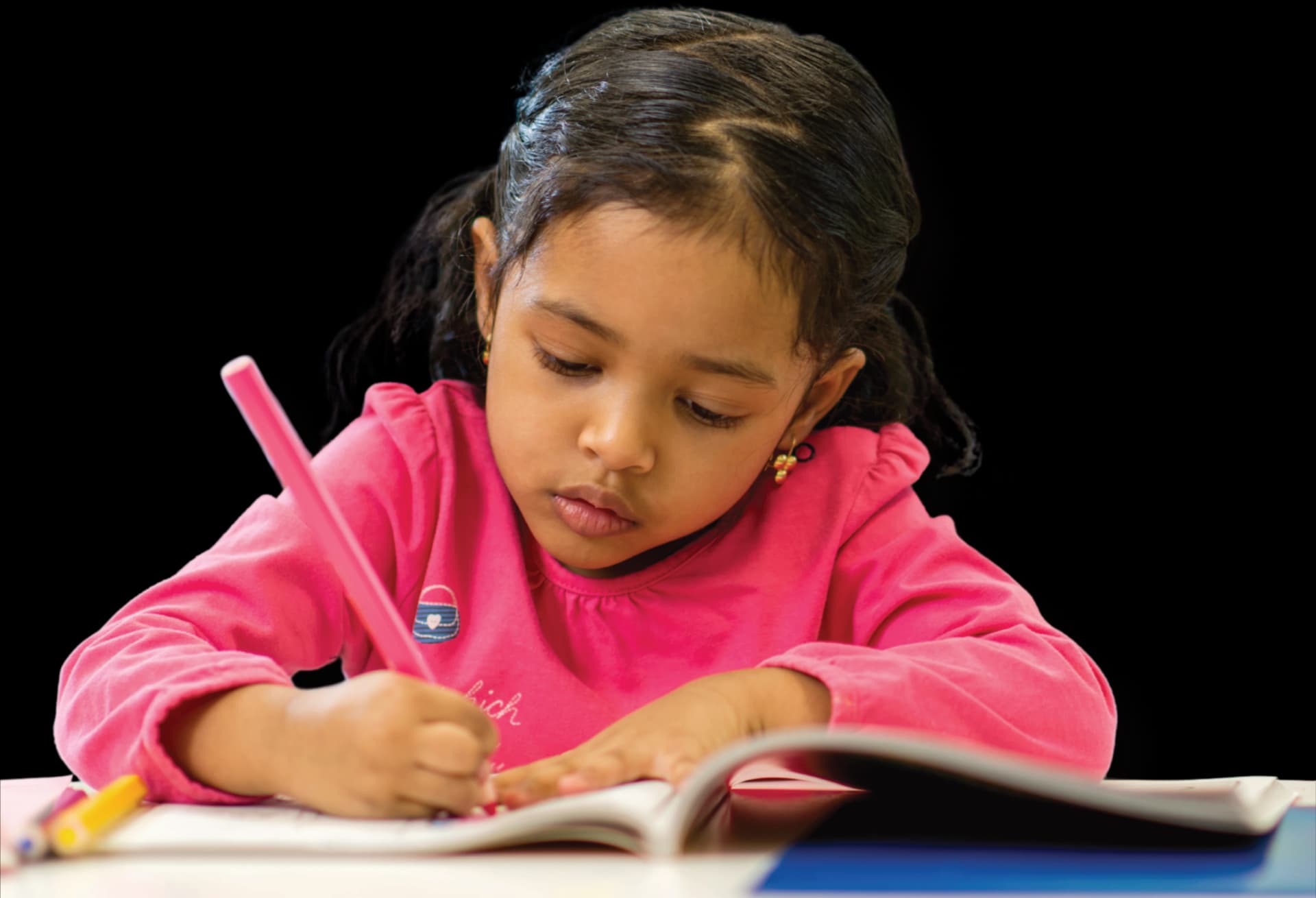 Child writing and practicing thoughtfully designed learning